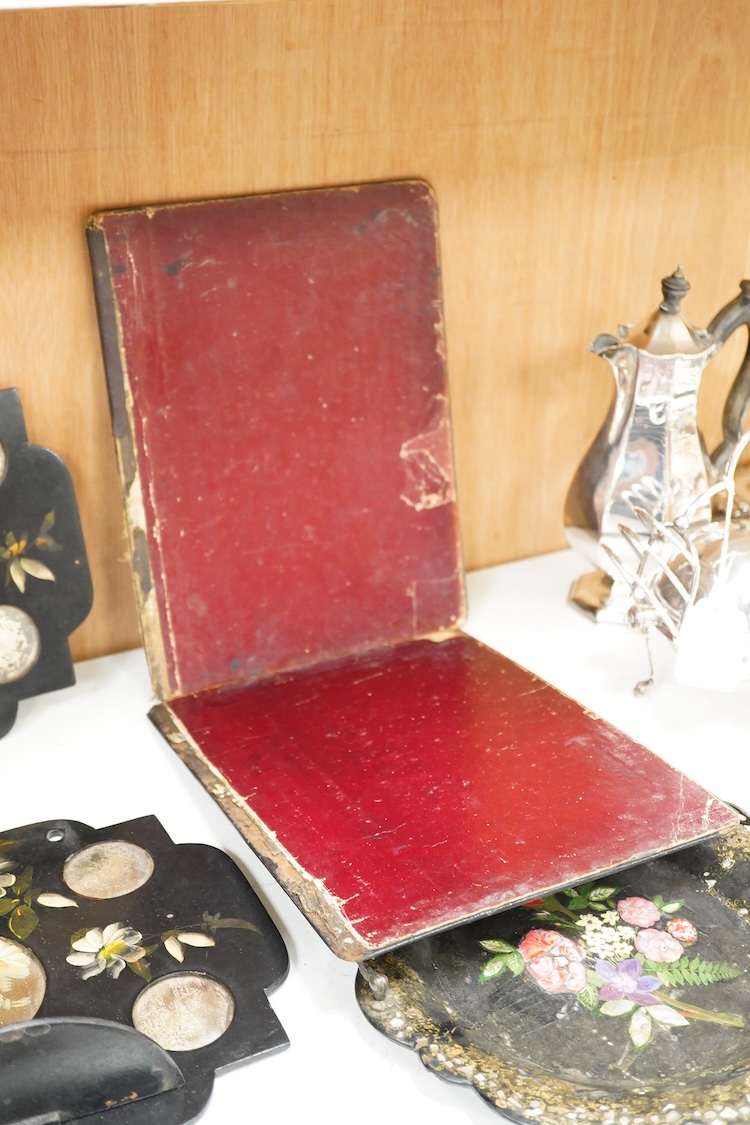 A collection of Victorian papier maché to include an inkstand, a pair of Victorian mirrored wall brackets and a swing handled dish, largest 30cm high